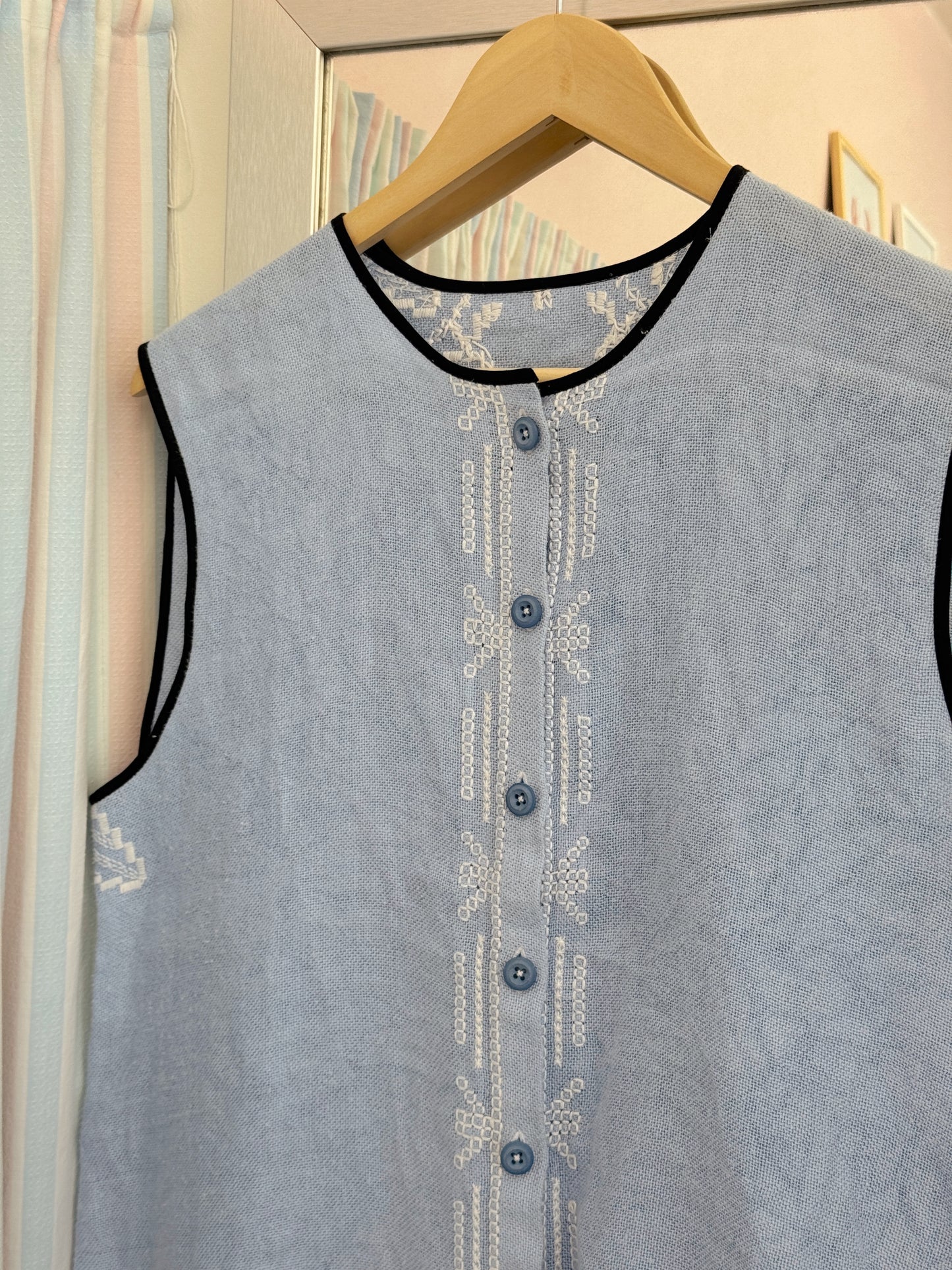 Vest med knapper