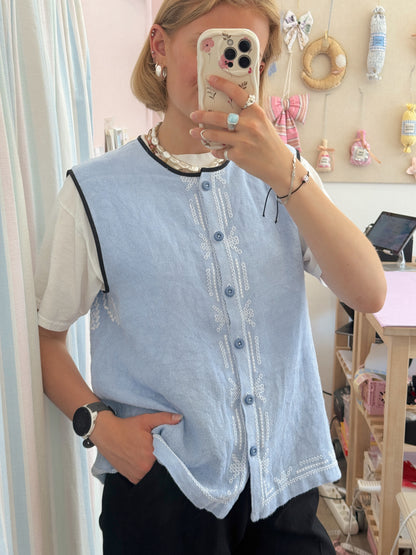 Vest med knapper